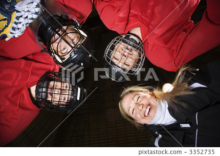 Women hockey player huddle. Women hockey player huddle. 3352735