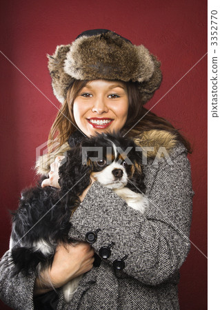 Woman holding dog. 3352770