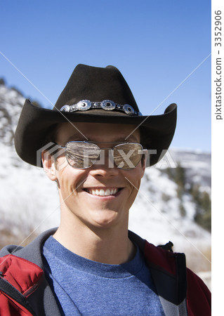 Man wearing cowboy hat. 3352906