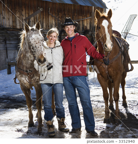 Couple holding horses. Couple holding horses. 3352940