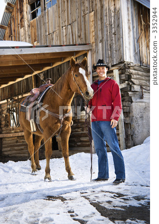 Man holding horse. 3352944