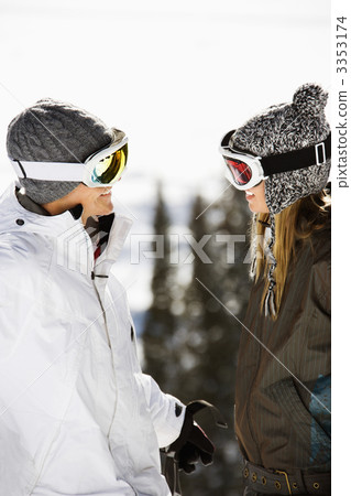 Two Skiers Smiling at Each Other Two Skiers Smiling at Each Other 3353174