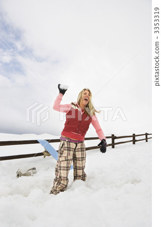 Woman throwing snowball. Woman throwing snowball. 3353319