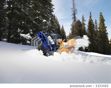 Man with stuck snowmobile. Man with stuck snowmobile. 3353483
