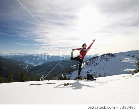 Woman doing yoga in snow. 3353485