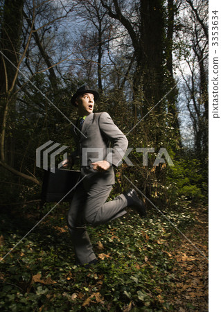 Young Businessman Running In Woods 3353634