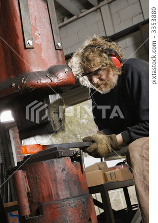 Man using power hammer. 3353880