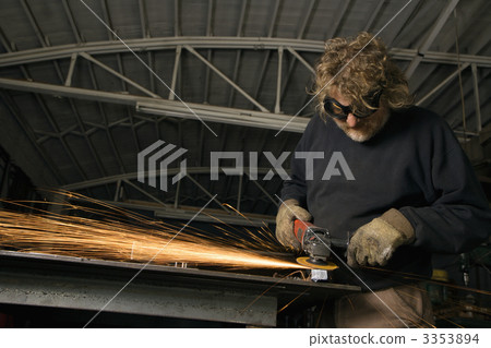 Metalsmith creating sparks. 3353894
