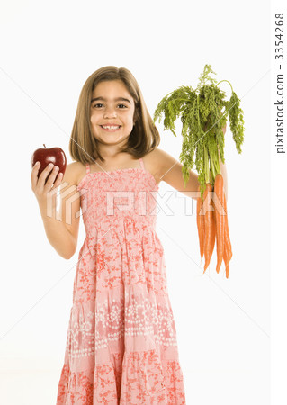 Girl holding vegetables. 3354268