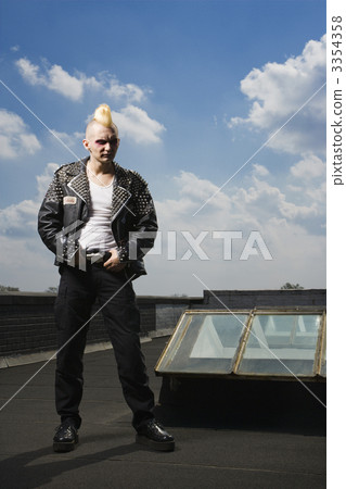 Punk standing on roof. 3354358