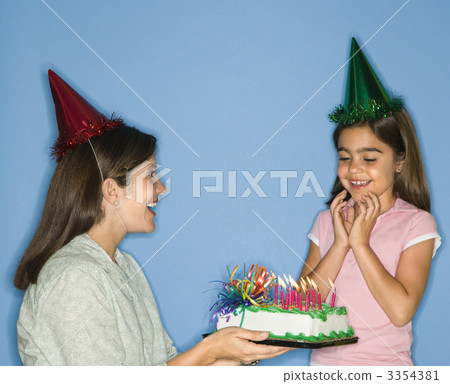 Girl getting birthday cake. 3354381