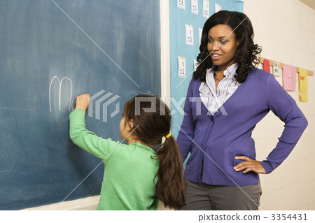 Teacher and Student at Blackboard 3354431