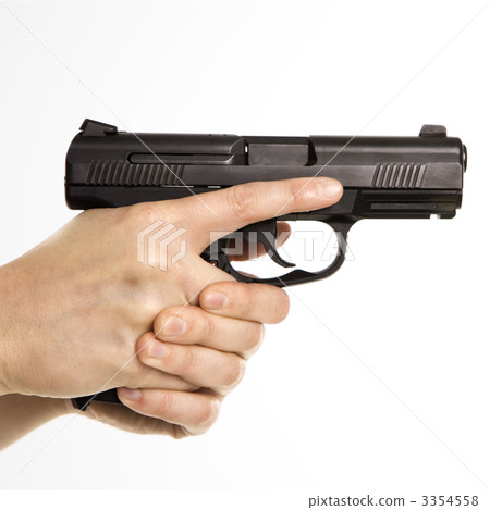 Female holding handgun. 3354558