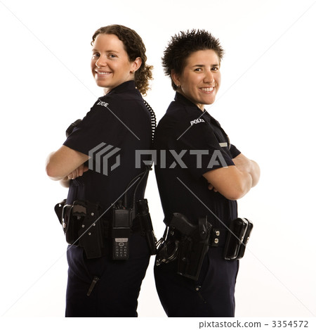 Policewomen back to back. 3354572