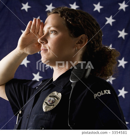 Policewoman saluting. Policewoman saluting. 3354581