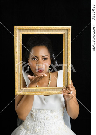 Bride holding frame. 3355085