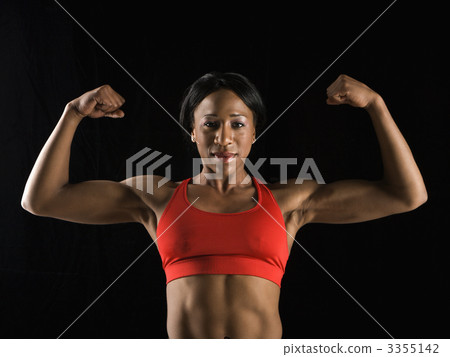 Woman flexing muscles. Woman flexing muscles. 3355142