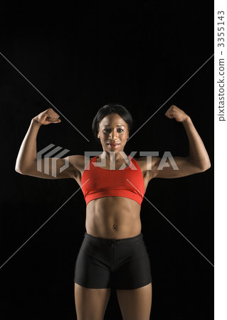 Woman athlete flexing muscles. Woman athlete flexing muscles. 3355143