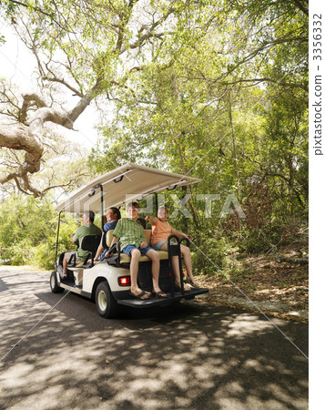 Family in golf cart. 3356332