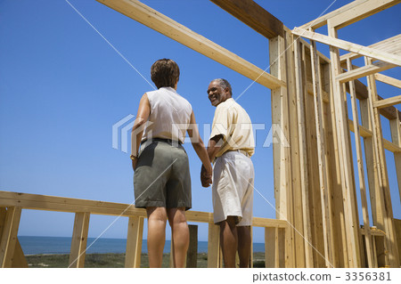 Couple at new home site. Couple at new home site. 3356381