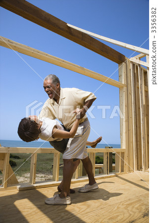 Happy couple at new home site. Happy couple at new home site. 3356382