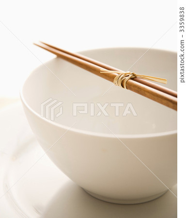 Chopsticks on an Empty Bowl. Isolated 3359838