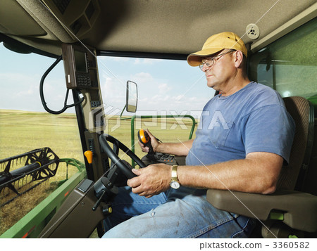 Farmer in combine. Farmer in combine. 3360582