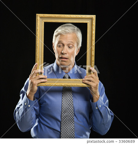 Man holding picture frame. Man holding picture frame. 3360689