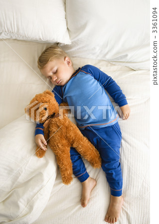 Toddler sleeping with bear. 3361094