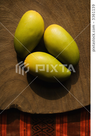 Three wooden mangoes. 3361139
