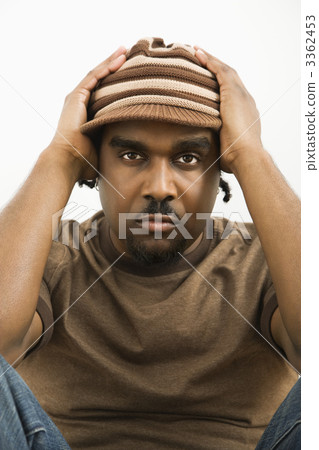 Man holding hat on head. Man holding hat on head. 3362453