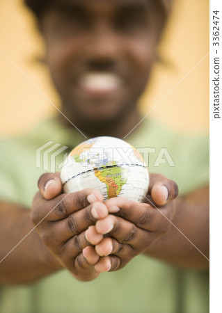 Man holding globe. Man holding globe. 3362474