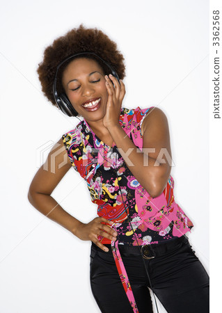 Woman listening to headphones Woman listening to headphones 3362568
