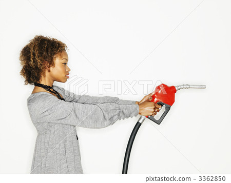 Woman holding gas gun 3362850