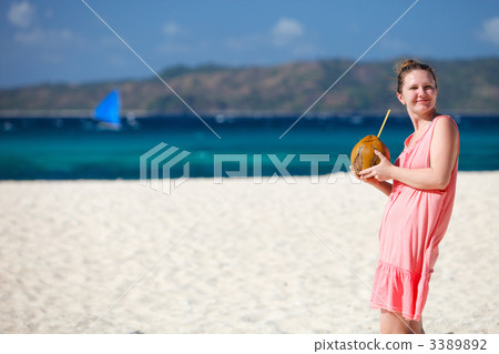 Young woman with coconut 3389892