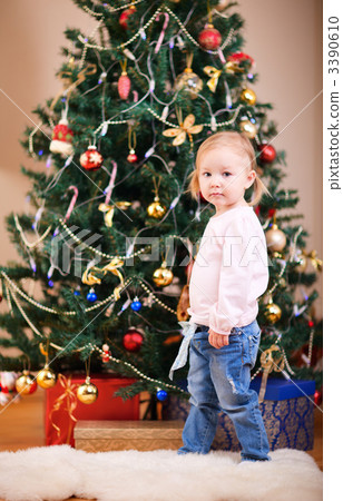 Toddler girl near Christmas tree 3390610