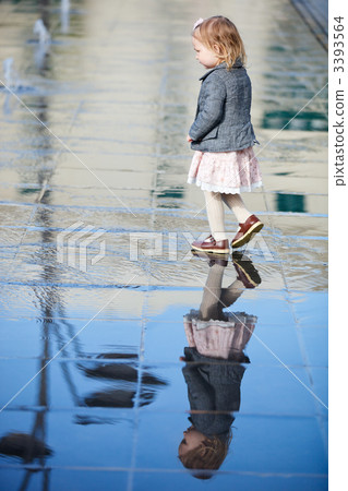 Little girl playing in street fountain Little girl playing in street fountain 3393564