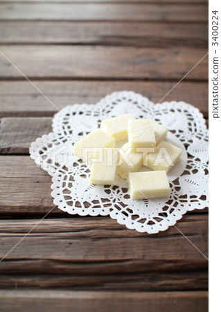 White chocolate ganache placed on lace paper 3400224