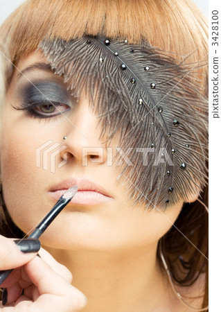 applying make-up applying make-up 3428100