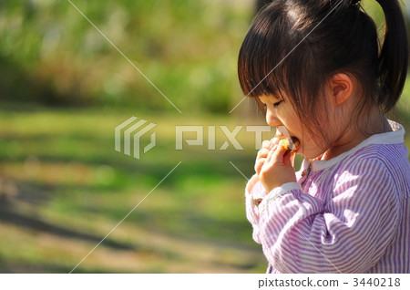 A girl who eats bread A girl who eats bread 3440218