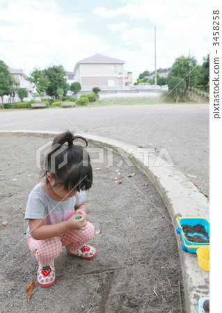 Three year old girl playing in the sandbox Three year old girl playing in the sandbox 3458258
