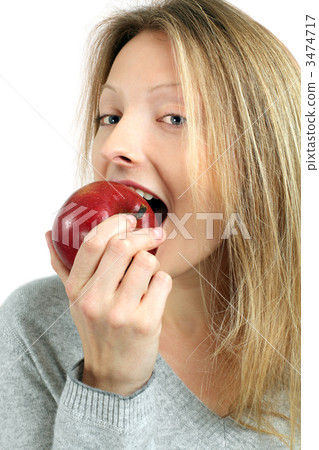 Woman eating an apple Woman eating an apple 3474717