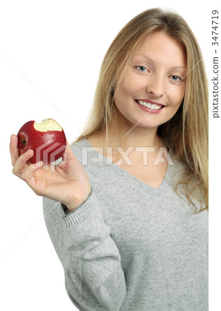 Beautiful blond eating an apple 3474719