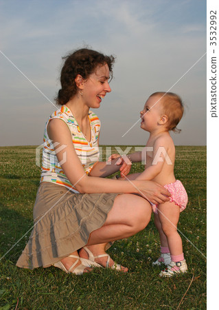 mother with baby on meadow 2 3532992