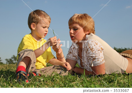 mother with boy on meadow mother with boy on meadow 3533087