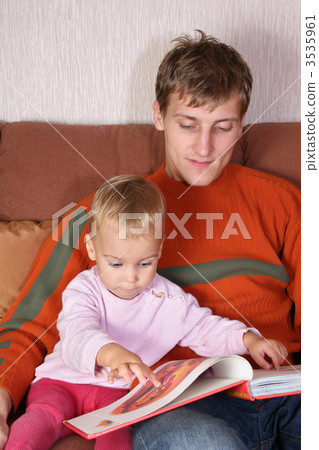 father with baby and book 3535961
