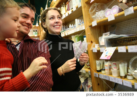 family in cosmetic shop 3536989