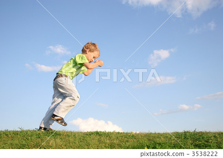 starting boy on meadow 3538222