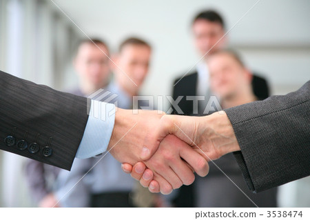 shaking hands and business team shaking hands and business team 3538474