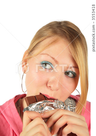 Young girl in suit eats chocolate 3553418